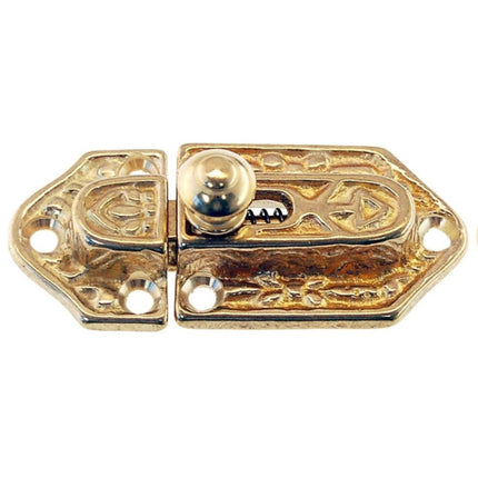 A Victorian style brass cabinet latch and catch with intricate detailing. color brass
