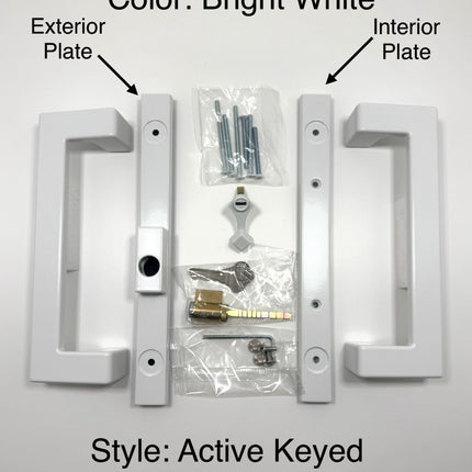 Amesbury Truth modern rectangular sliding patio door handle in a Bright White finish, shown with their mounting hardware including screws on a plain white surface. Wording on picture states: Color Bright White. Style Active Keyed Offest Latch, exterior plate with arrow pointing to handle set plate and interior plate with arrow pointing to the second handle set plate. 