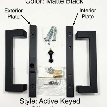 Amesbury Truth modern rectangular sliding patio door handle in a Matte Black finish, shown with their mounting hardware including screws on a plain white surface. Wording on picture states: Color Matte Black. Style Active Keyed Offest Latch, exterior plate with arrow pointing to handle set plate and interior plate with arrow pointing to the second handle set plate. 