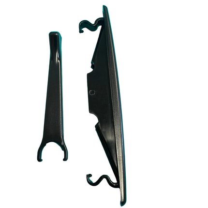 A black escutcheon and latch accessory piece, photographed on a bright white background.