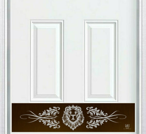 Decorative door kick plate with lion design on a white door